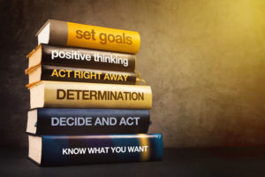 39656328 - six steps to business success literature, mastering business management concept with stack of published books.
